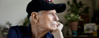 An older U.S. veteran looking pensive