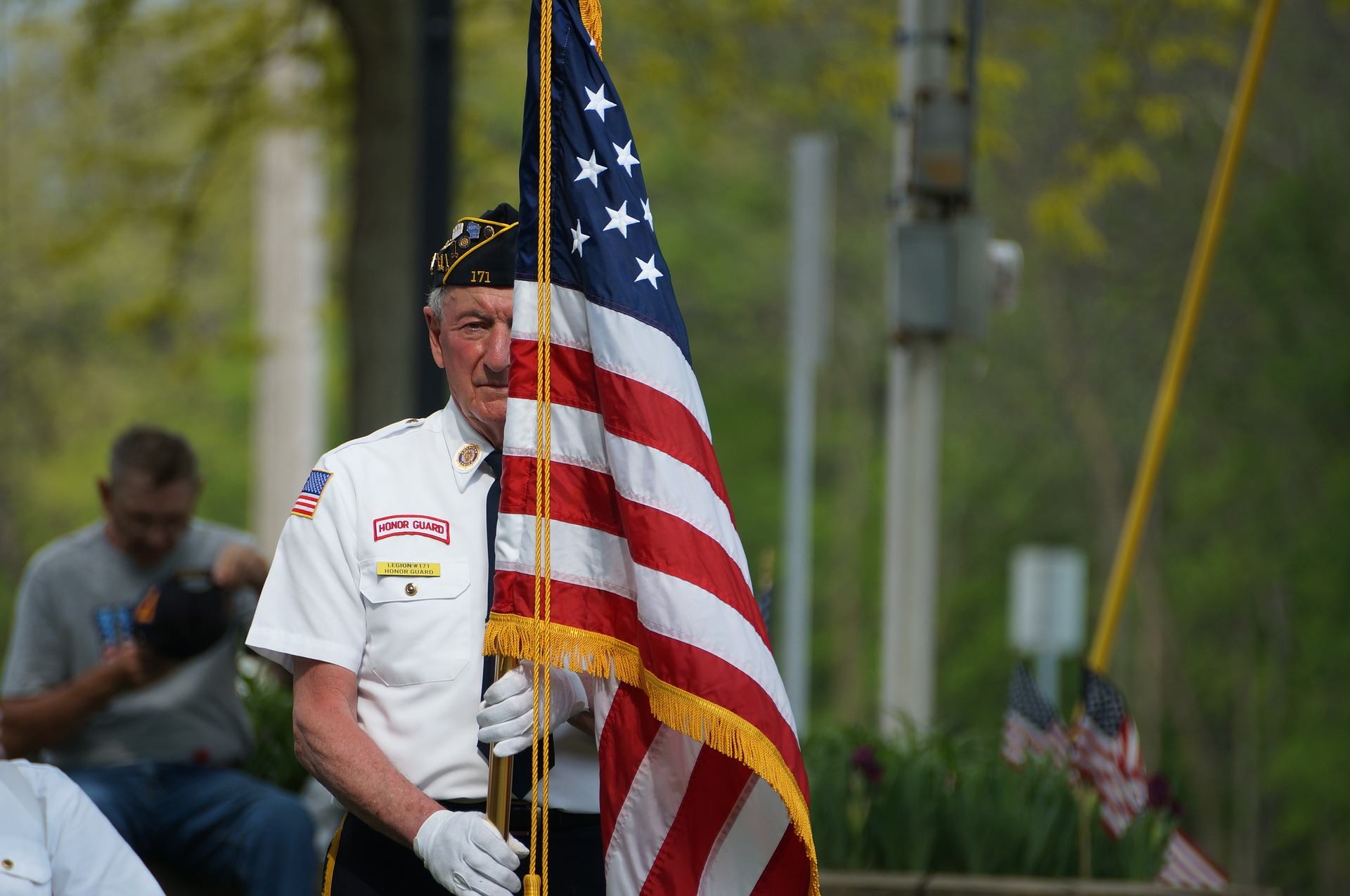 Older veteran holding an american flag