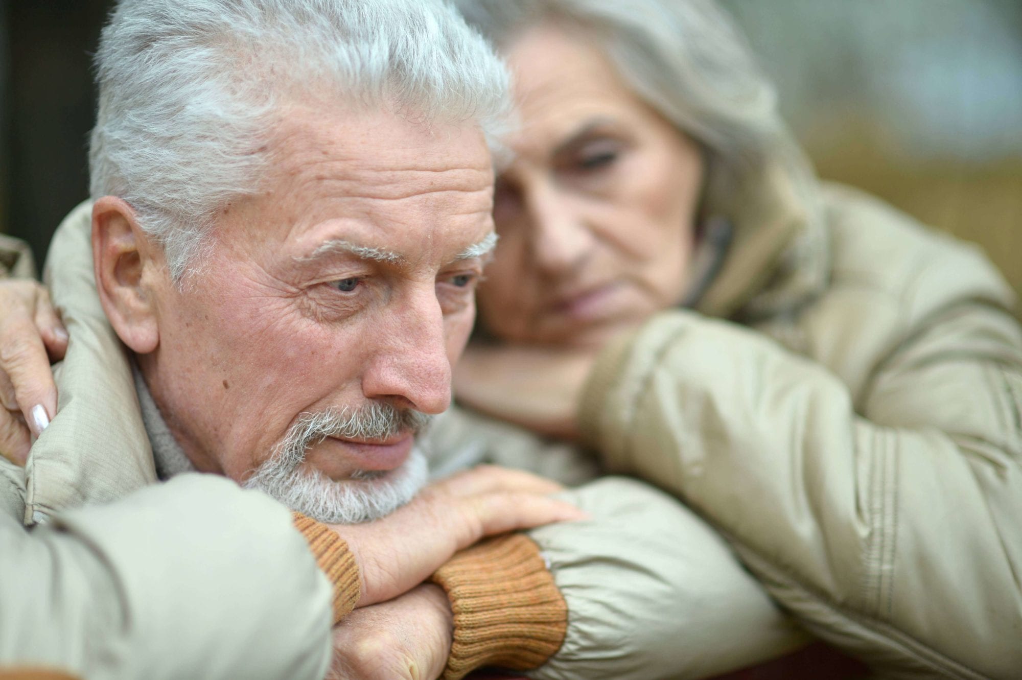 Elderly Couple Looking Sad