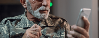 military veteran looking at cellphone
