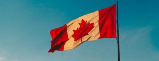 close up of canadian flag flying in the wind