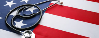 A stethoscope rests on an American flag