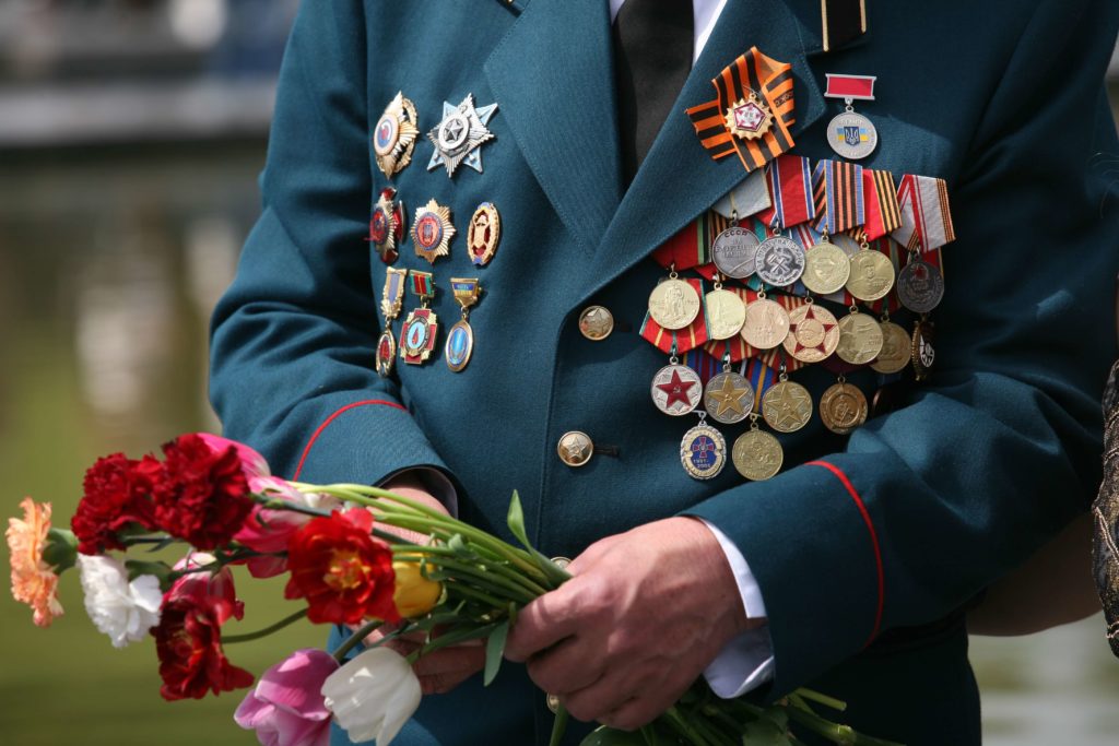 veteran holding flowers
