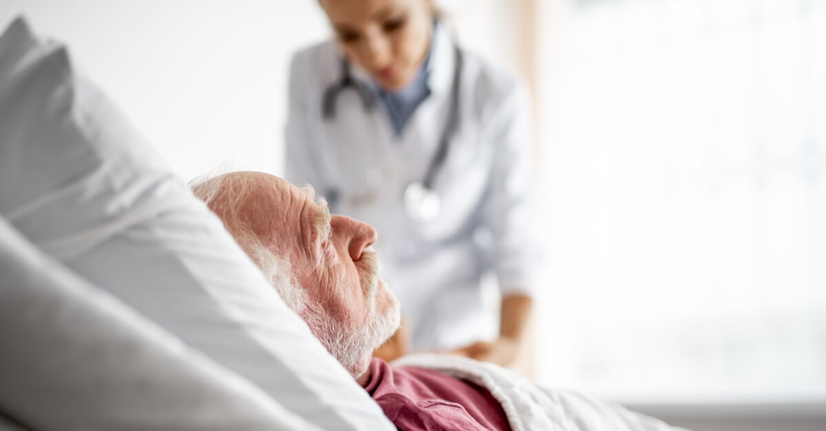 older man in hospital bed