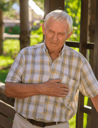 an elder male clutches his chest