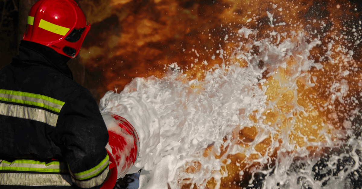 a firefighter puts out a fire