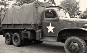 A black-and-white photo of a military truck