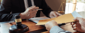 A lawyer receives a manila envelope from a client