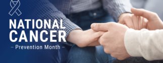 a banner with text that reads "National Cancer Prevention Month." Two people sit and hold hands, but their faces aren't visible.