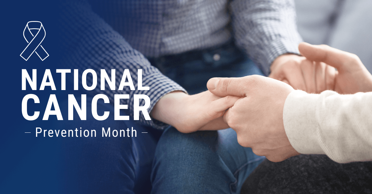 a banner with text that reads "National Cancer Prevention Month." Two people sit and hold hands, but their faces aren't visible.