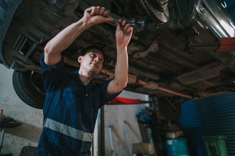 auto mechanic working on a car