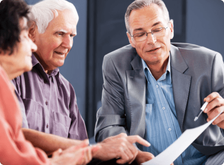 An older couple works with an attorney
