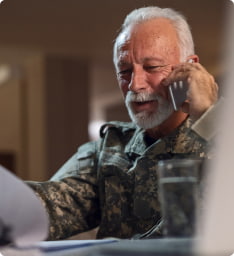An older veteran talks on the phone