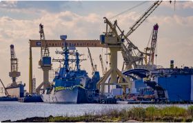 Image of a ship getting serviced in a shipyard