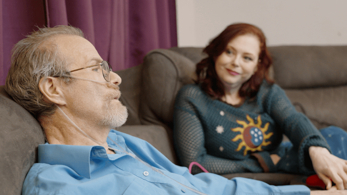 Alan and Connie Bonnin sitting on a couch