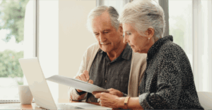 An older couple looking at documents