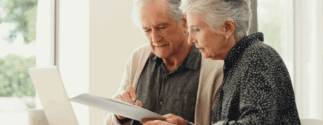 An older couple looking at documents