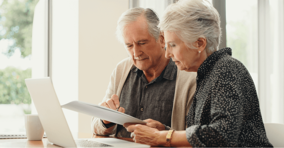 An older couple looking at documents